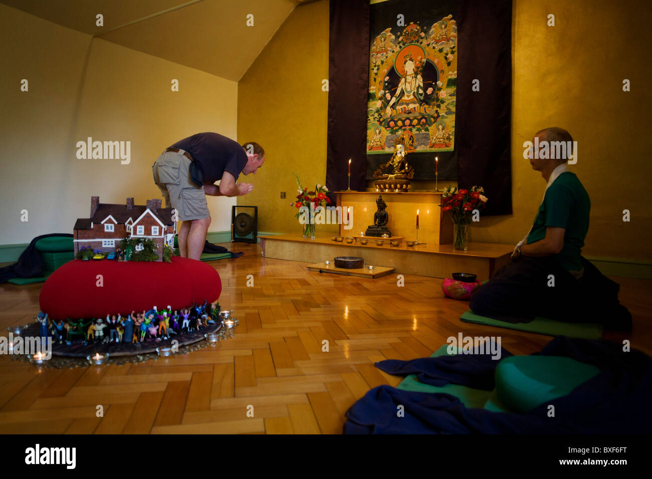Buddhists after silent meditation for 30 minutes in their Shrine Room at the Rivendell Buddhist Retreat Centre. Stock Photo