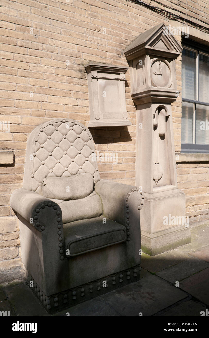 Stone Chair and Grandfather clock in Little Germany, Bradford. Stock Photo