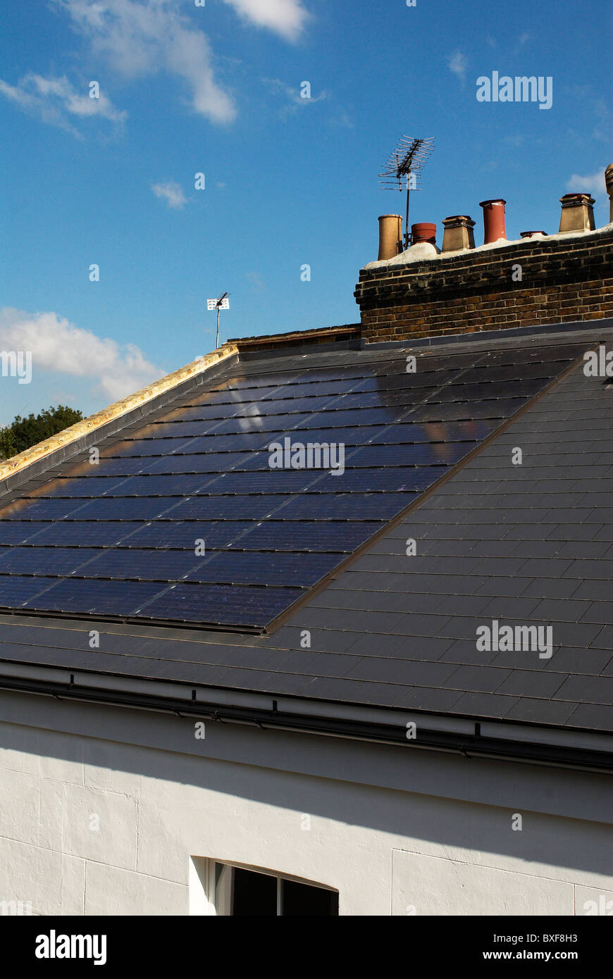 Photovoltaic roof panels on roof of Victorian house Camden Town London