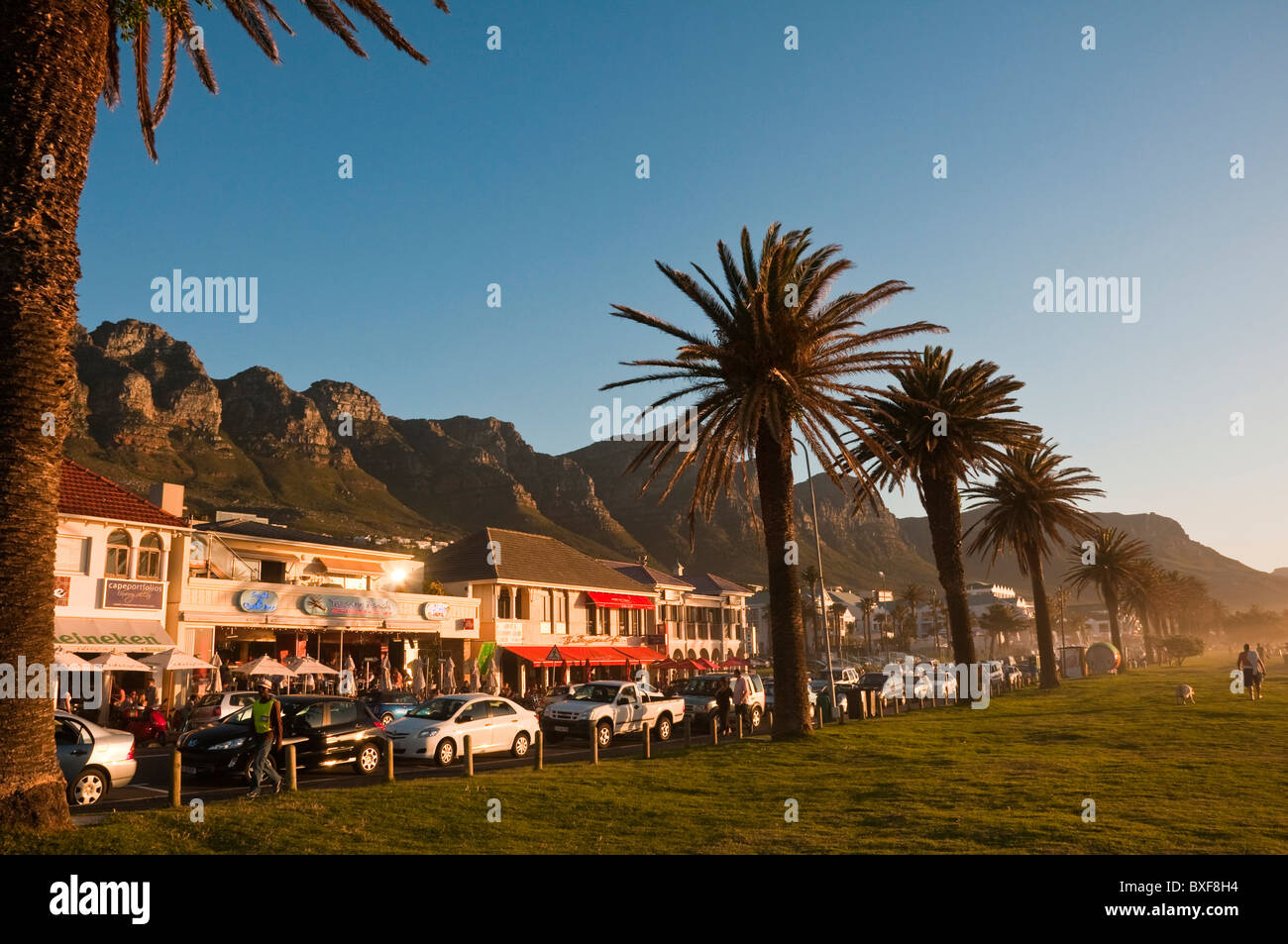 Street with houses at Camps Bay, The Twelve (12) Apostles in the background. Cape Town. Western Province. South Africa. Stock Photo