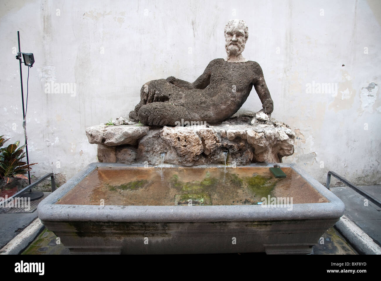 Roman statue of Silenus, La fontana del 'babuino' one of the talking statues of Rome, in Via del Babuino, Rome. Stock Photo