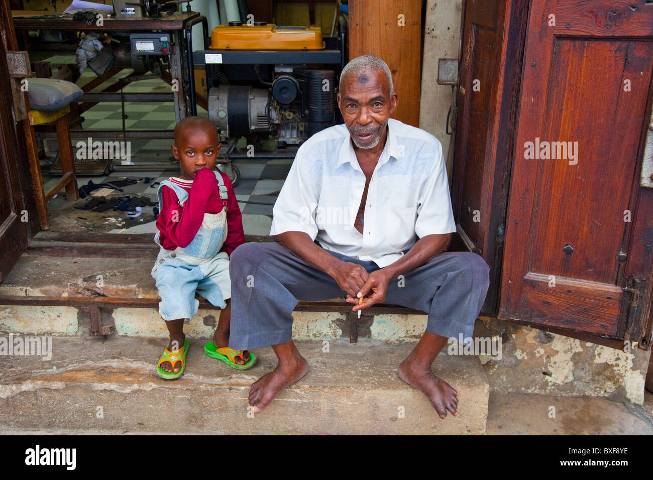 Muslim Tailor and his grandson, old town, Mombasa, Kenya Stock Photo