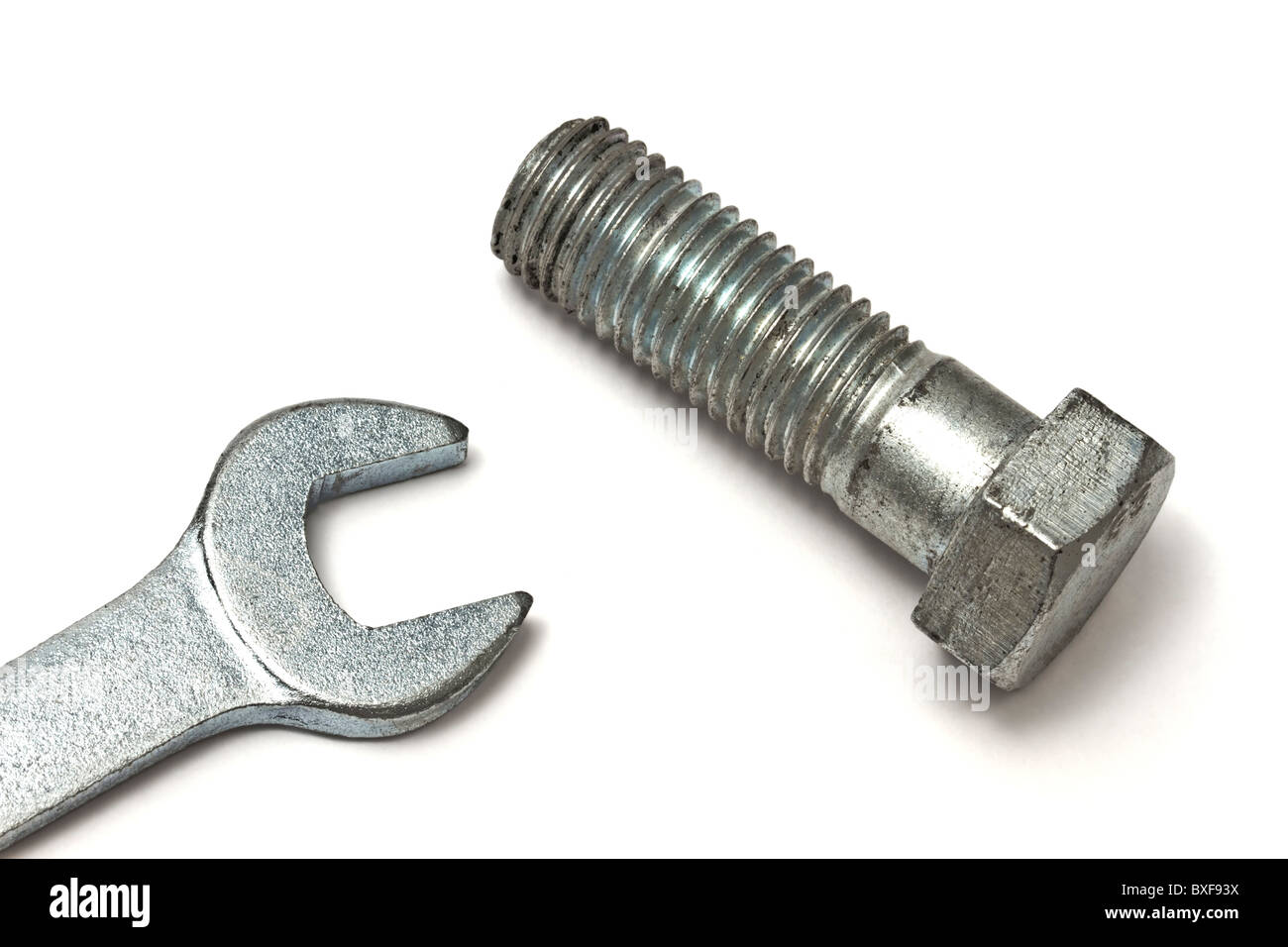 Wrench and bolt isolated on white background Stock Photo - Alamy