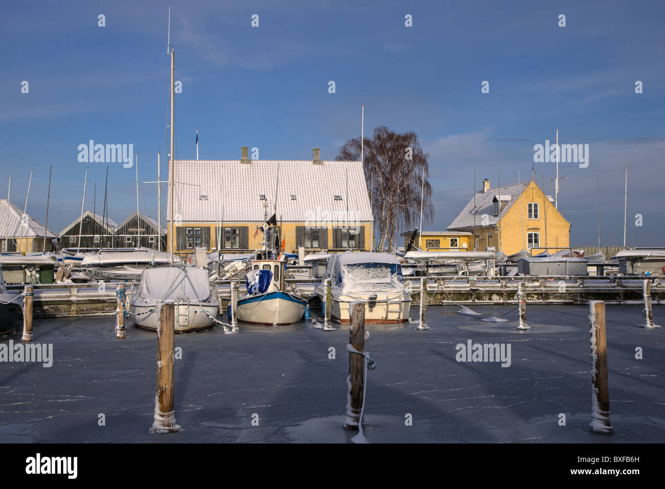 Snow and ice covered Dragor harbour Stock Photo