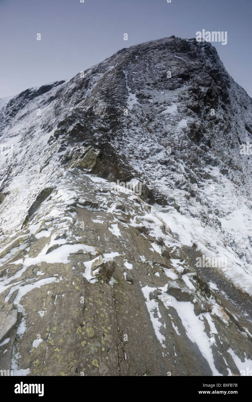 Sharp Edge in winter, the infamous and dangerous steep ridge leading up to Blencathra, Lake District, Cumbria Stock Photo