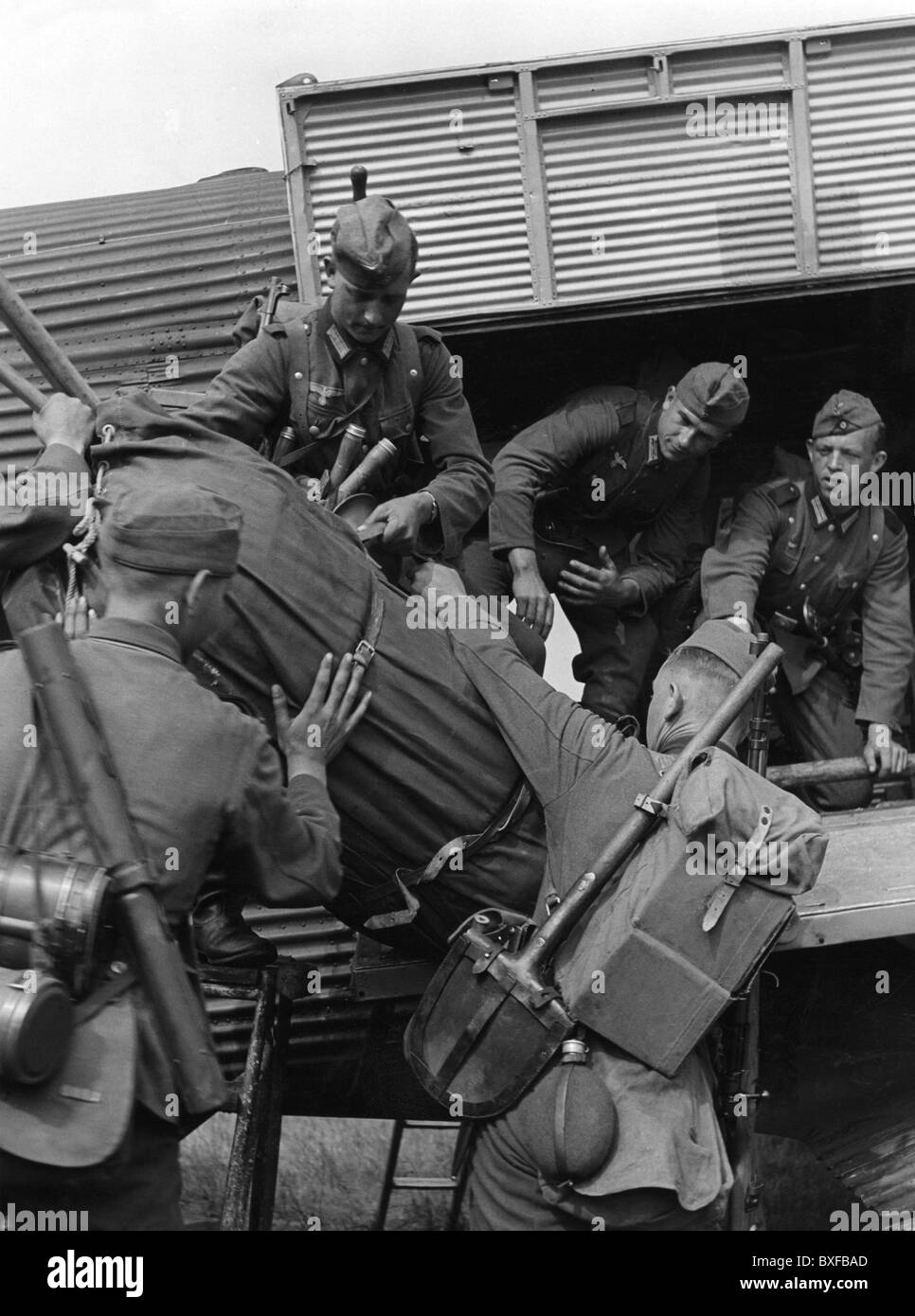 Nazism / National Socialism, military, Wehrmacht, army, soldiers loading equipment into a transport plane Junkers Ju 52, circa 1940, Germany, Third Reich, Second World War, WWII, uniform, uniforms, 20th century, historic, historical, spade, spades, aircraft, air transportation, 1930s, 1940s, people, Additional-Rights-Clearences-Not Available Stock Photo