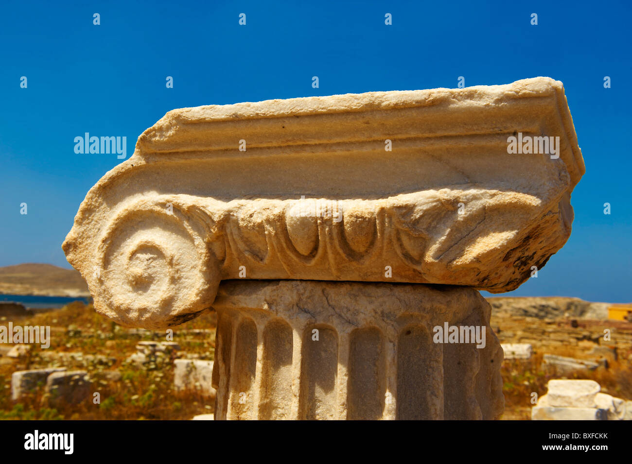 Delos Inscription Column Ionic column capital od Delos, Greek Cyclades Islands Stock Photo - Alamy