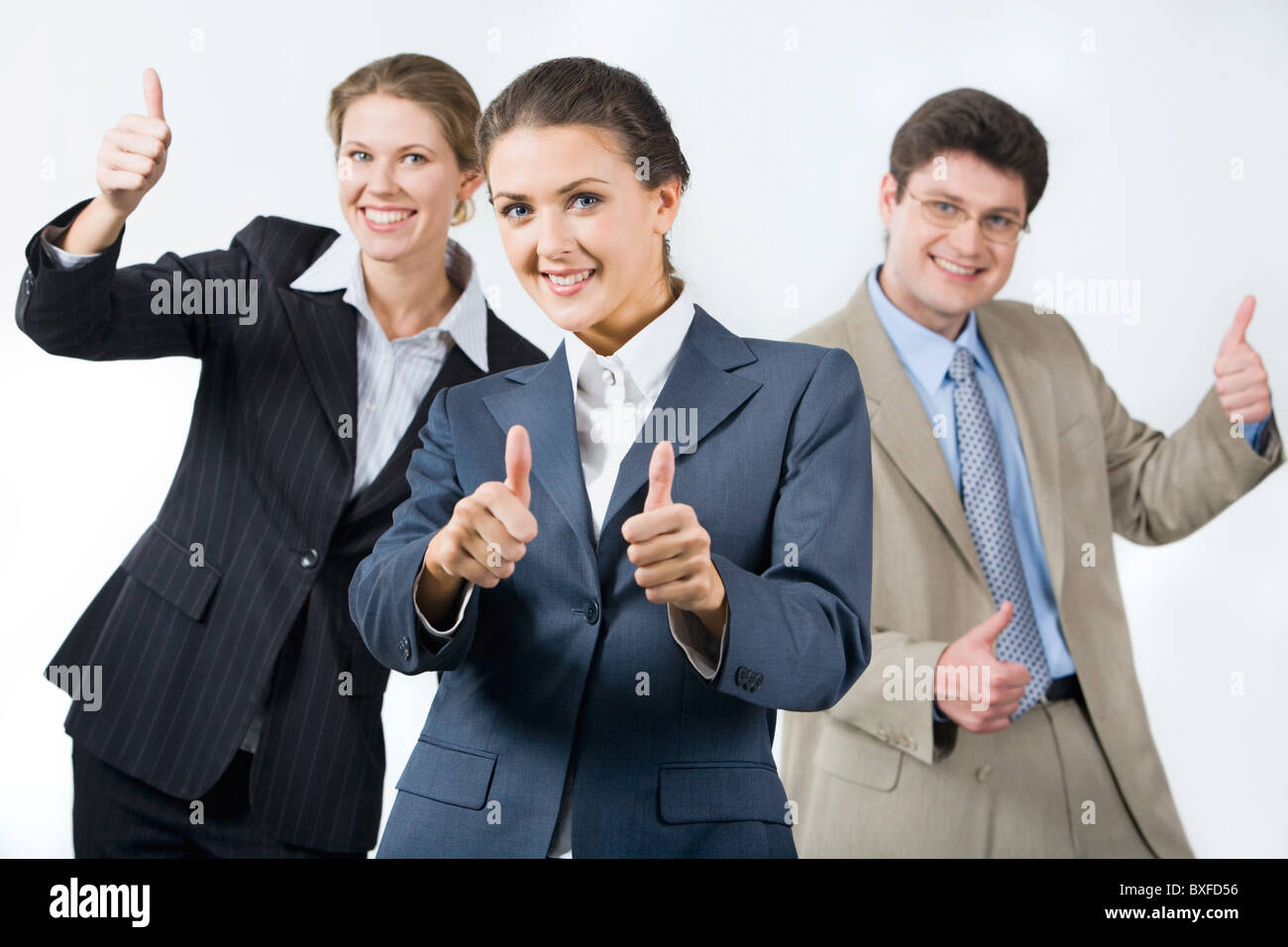 Portrait of successful business team showing sign of okay Stock Photo ...