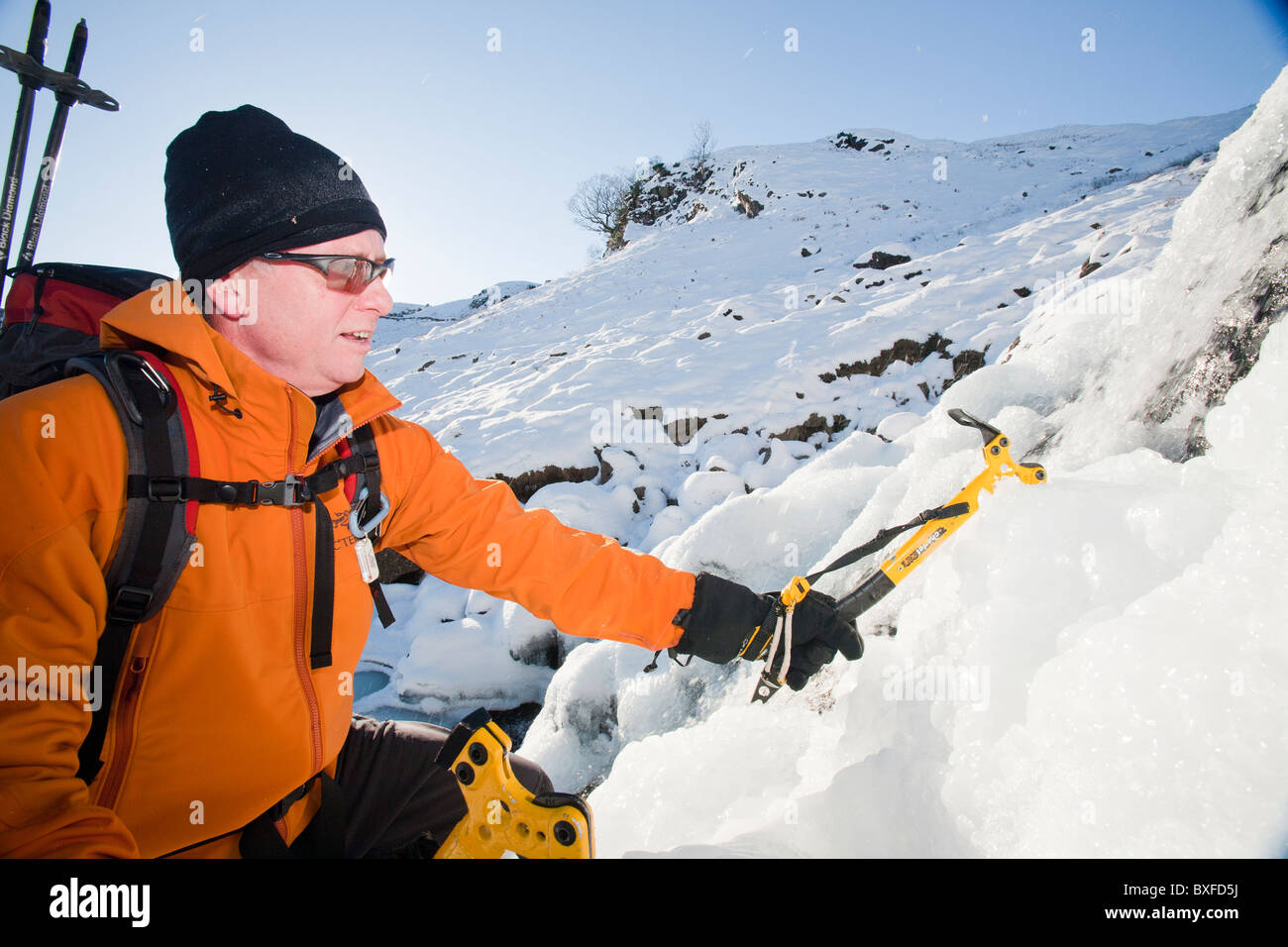 A mountaineer ice climbing on Sour Milk Ghyll in Easedale, Grasmere