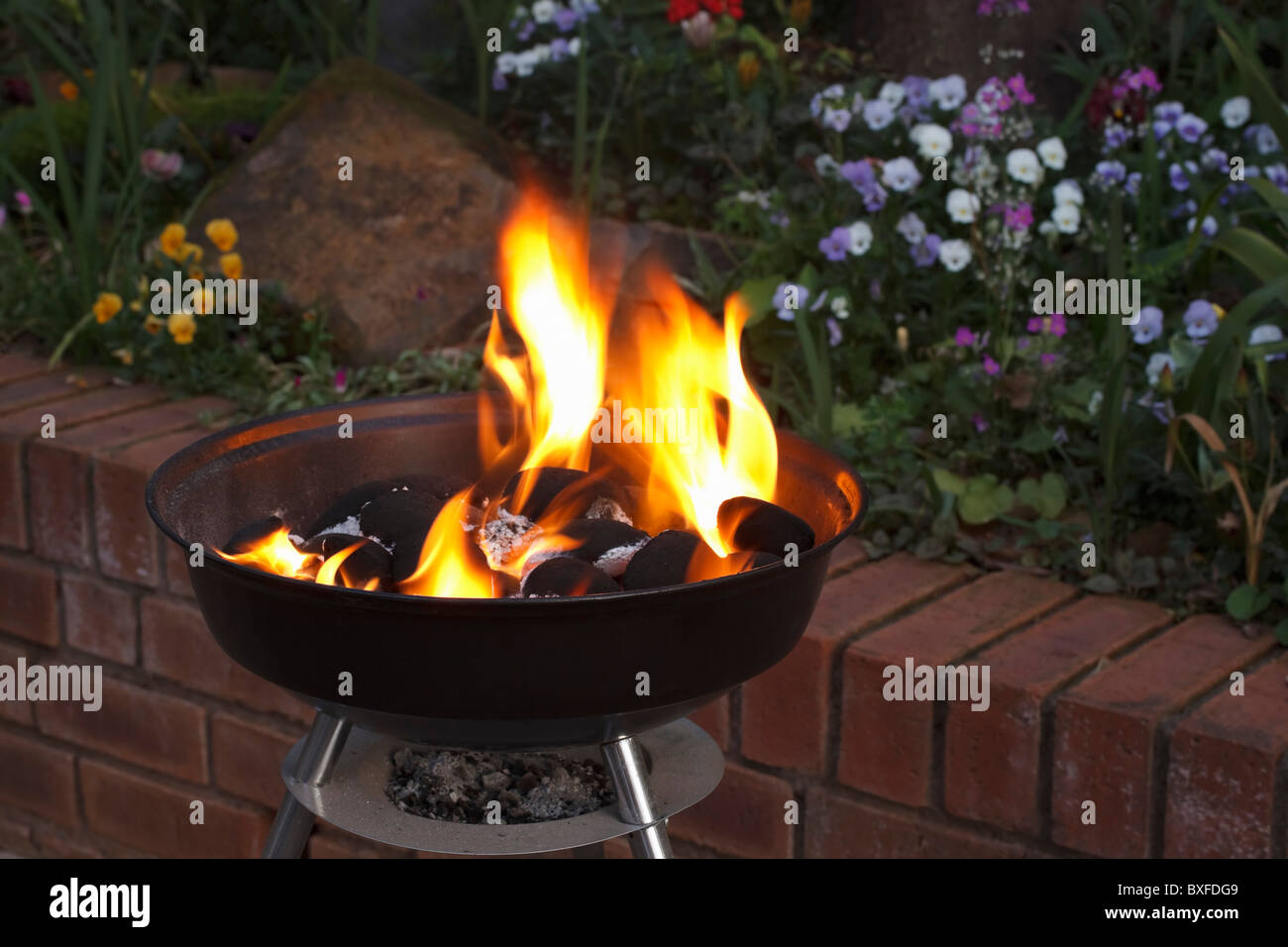 Closed kettle barbecue grill with burning charcoal Stock Photo Alamy