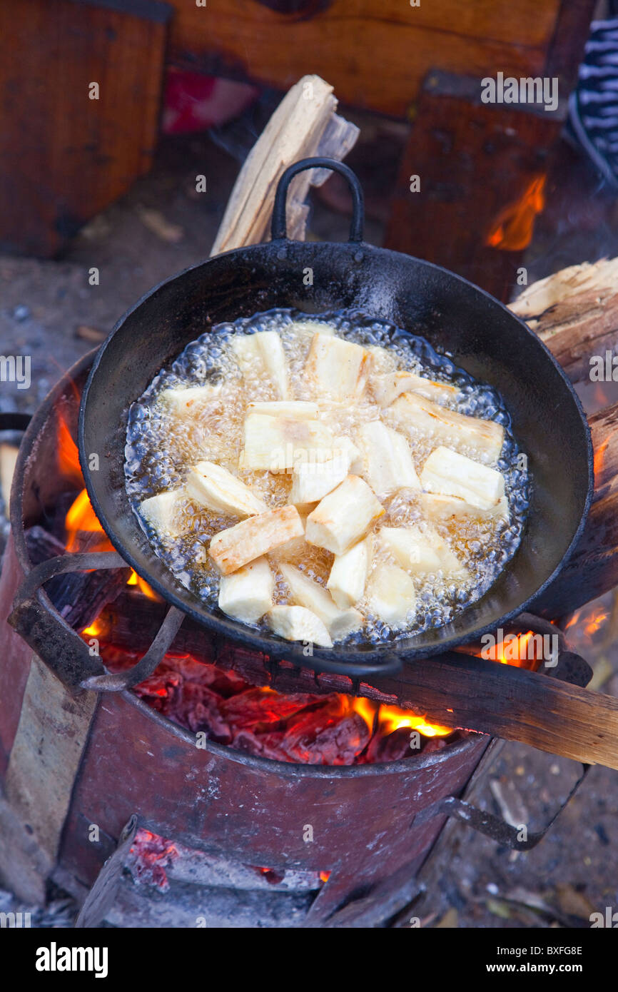 Fried cassava root, yuca or manioc, vendor in Mombasa, Kenya Stock Photo