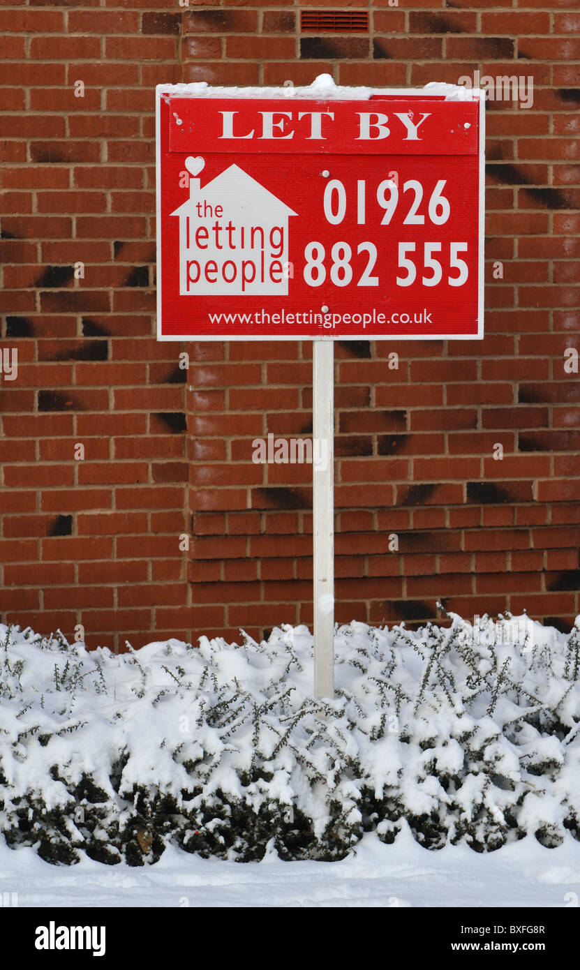 Estate agents board in winter, UK Stock Photo