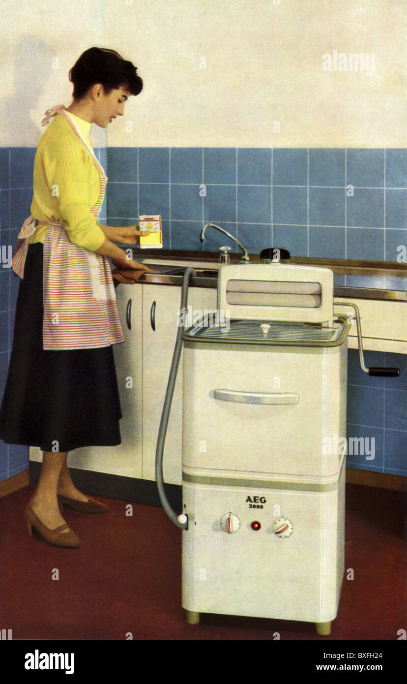 household, washing, housewife with washing machine AEG 3000, Germany, 1959, washing machines, laundry day, washday, housework, chores, housekeep, working, household appliance, domestic appliance, household utensil, household appliances, domestic appliances, household utensils, electric appliance, electrical device, electric appliances, electrical devices, economic miracle, economic miracles, 1950s, 50s, 20th century, historic, historical, people, woman, women, female, Additional-Rights-Clearences-Not Available Stock Photo