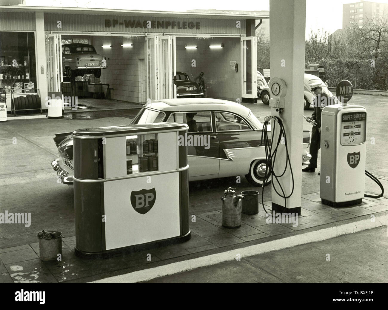 car, petrol station, filling station attendant is filling up car, Berlin, Germany, circa 1960, Additional-Rights-Clearences-Not Available Stock Photo