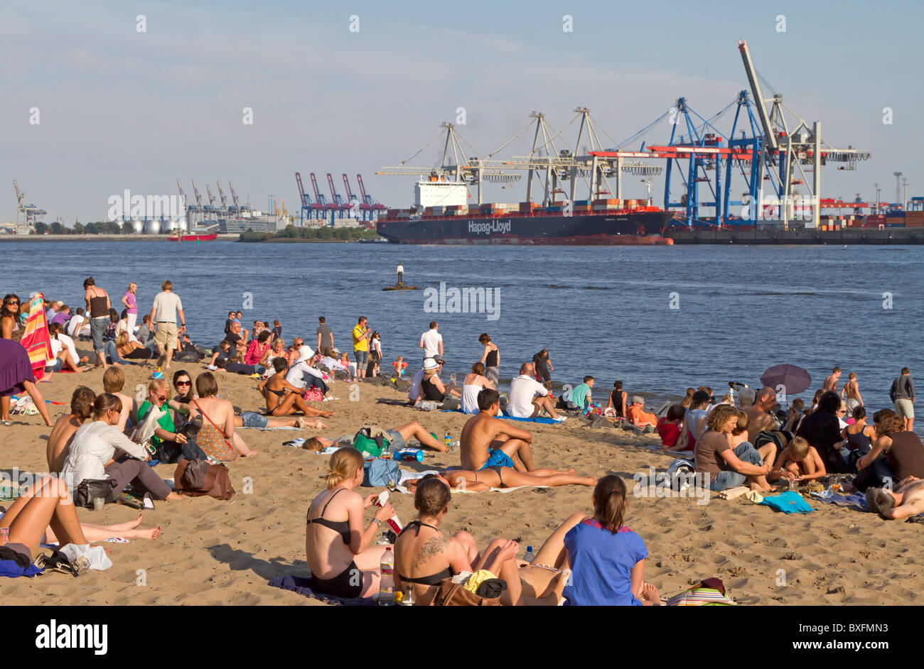 Sunbathing people at Hamburg beach Elbe Stock Photo