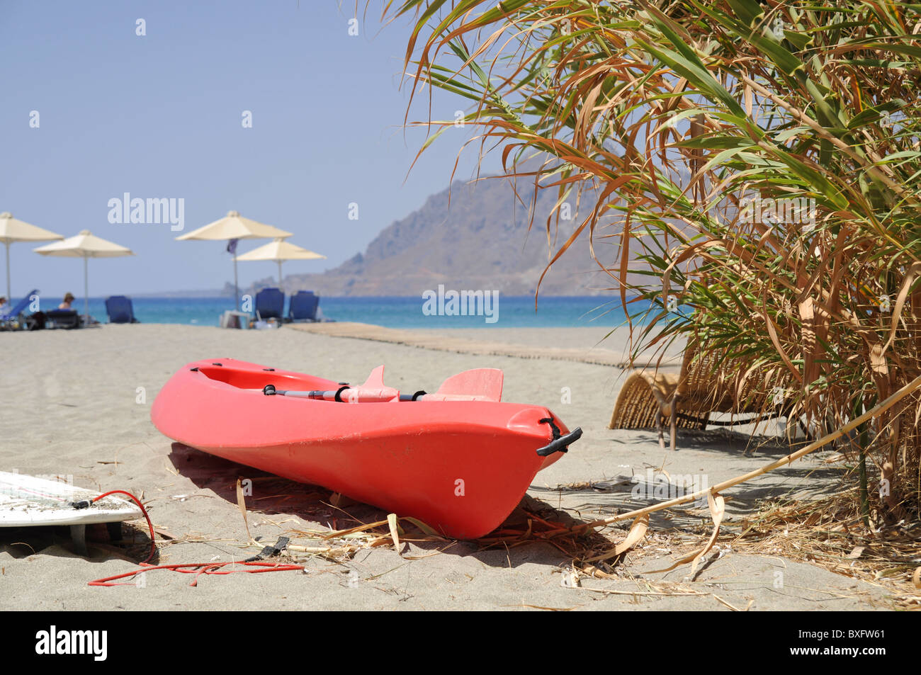 Red kayak in Plakias beach on Crete Stock Photo