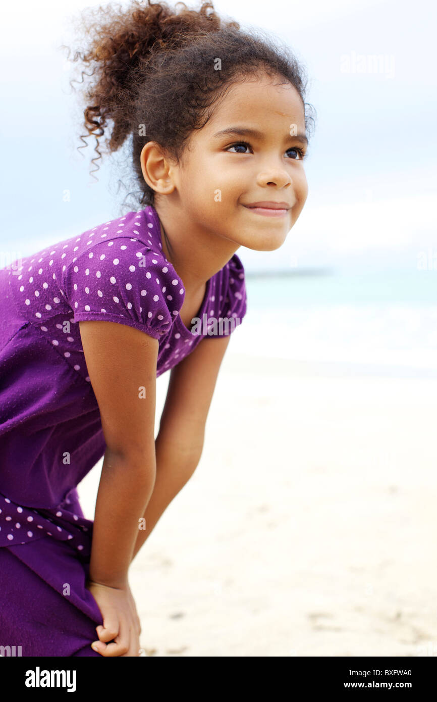 Mixed race girl on beach Stock Photo Alamy