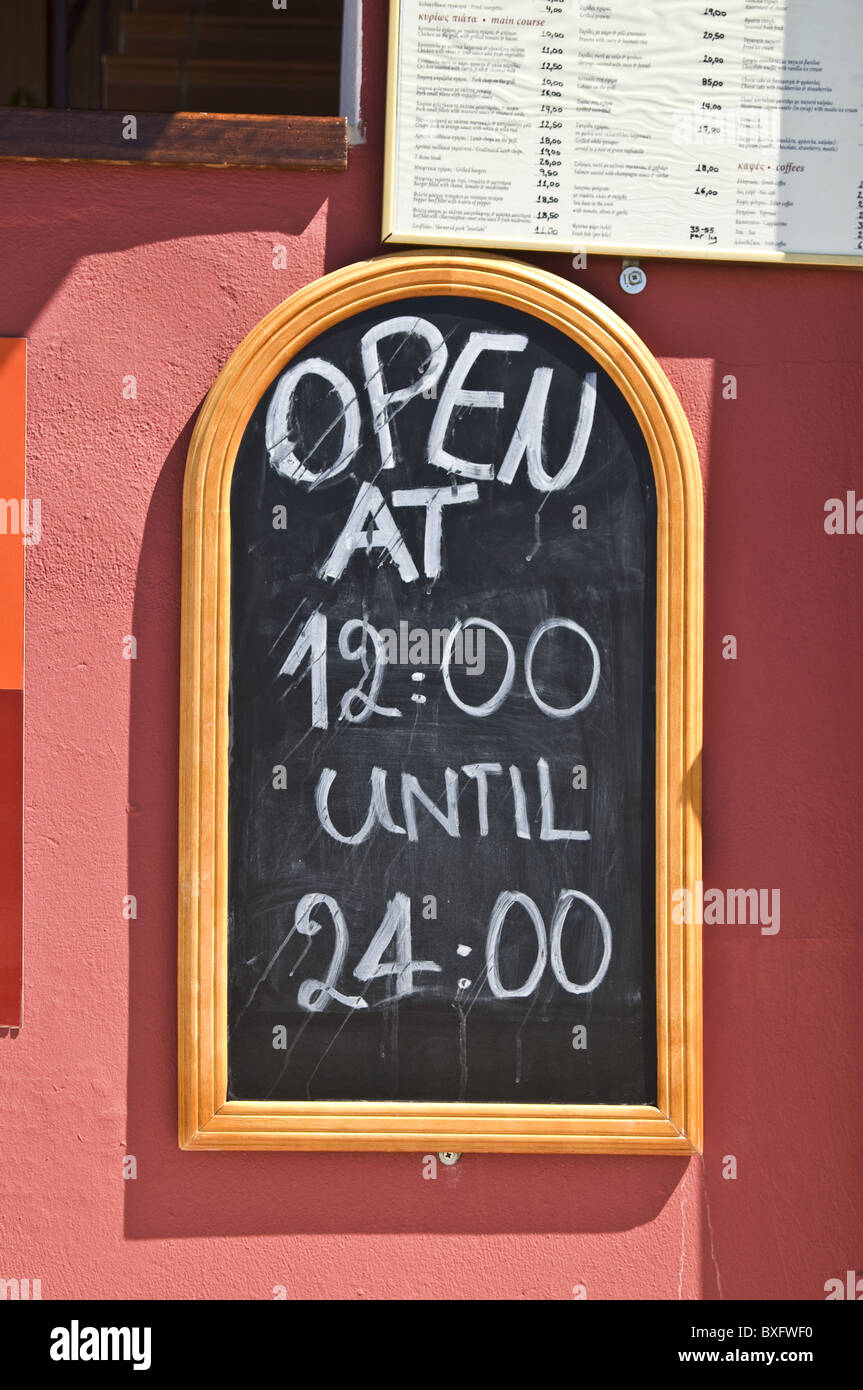 Restaurant board with open hours of restaurant Stock Photo