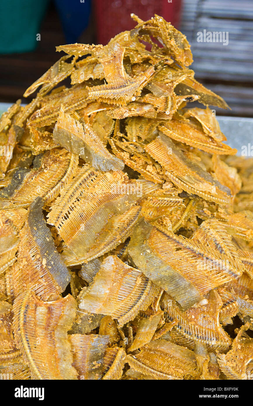 Fried fish bones for sale at food stall, Bangkok, Thailand. They are