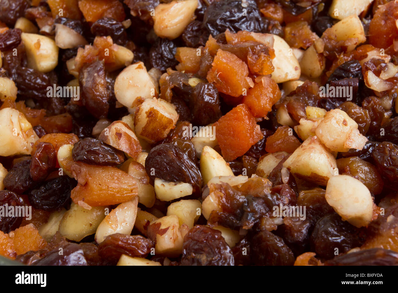 Background or texture of Xmas Cake Mix of nuts and soft fruits close up. Stock Photo