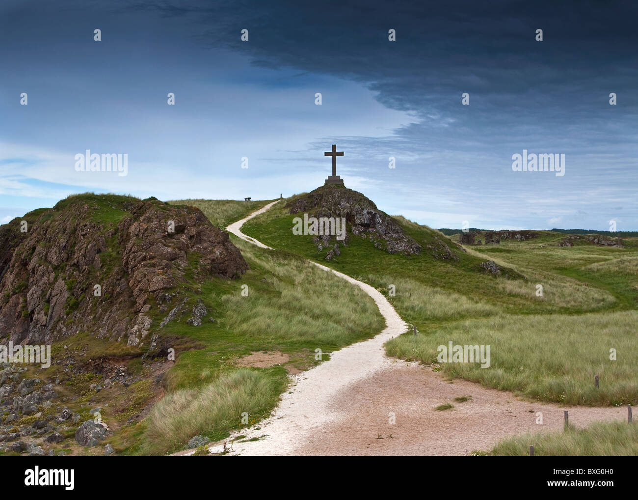 Cross under a dark sky Stock Photo - Alamy