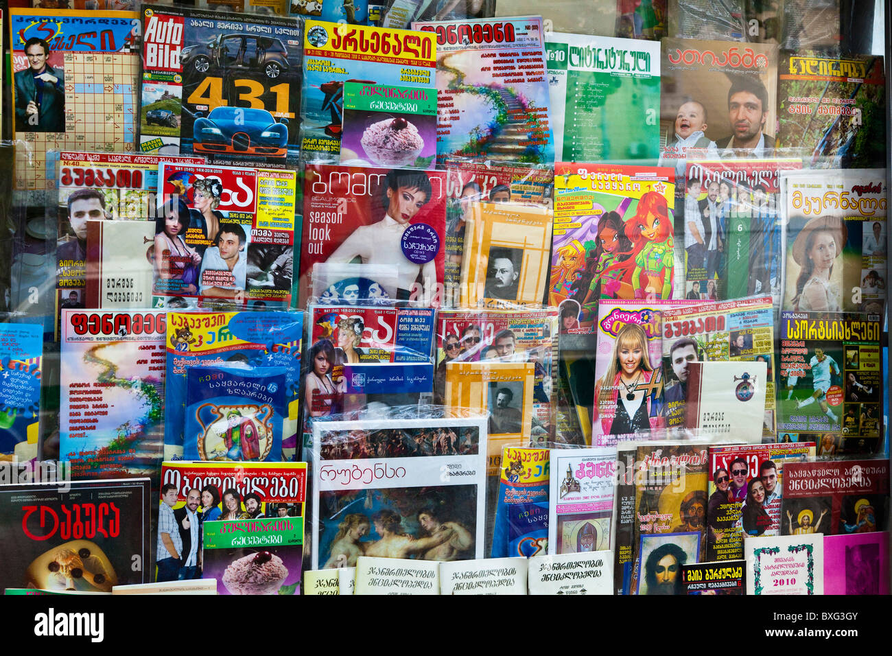 Magazines and periodicals on the side of a news stand or kiosk in the street in Tbilisi, Georgia. JMH3965 Stock Photo