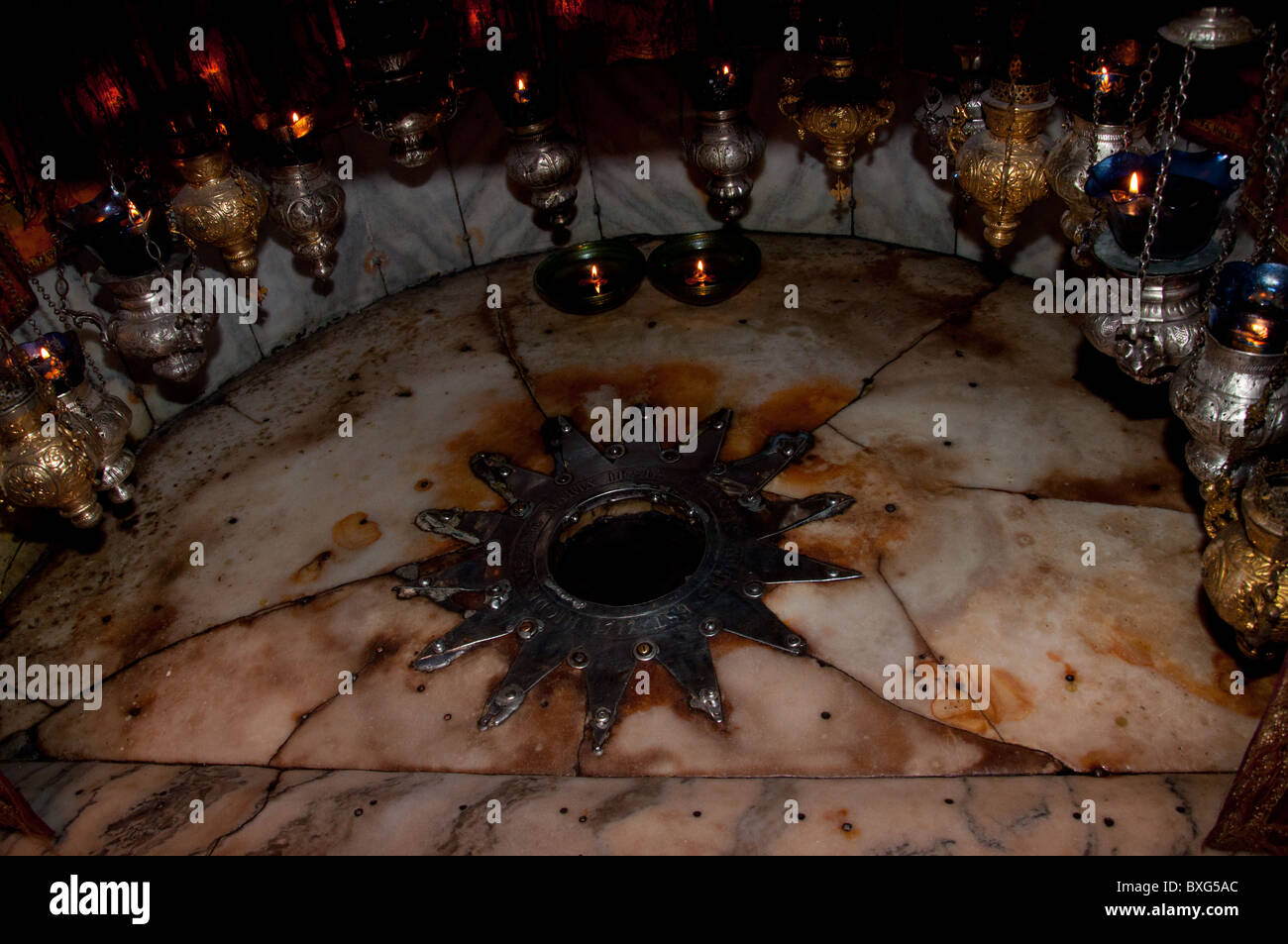 Star marking the traditional site on which Jesus was born in the Grotto of the Nativity Stock