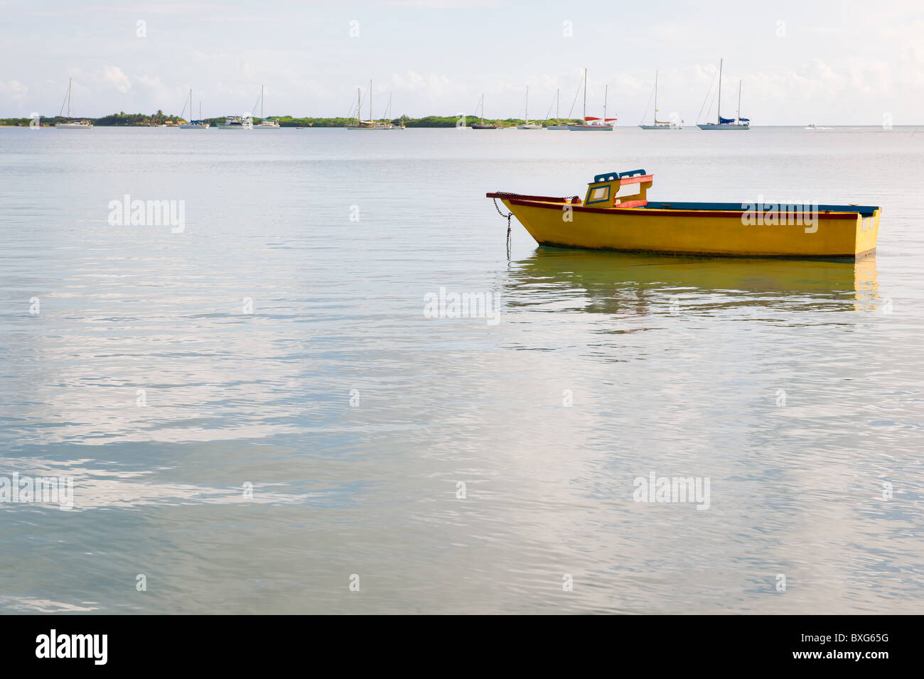 Landscape of ocean and yellow boat Stock Photo - Alamy