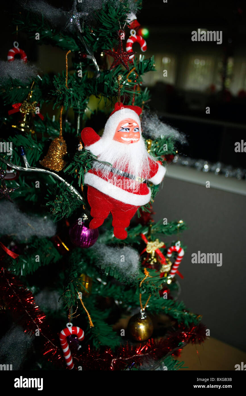 A christmas tree decoration with a santa claus hanging on it Stock Photo