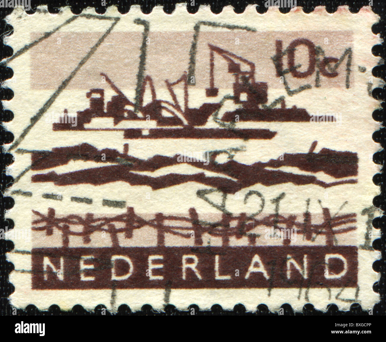 NETHERLANDS - CIRCA 1914: A stamp printed in the Netherlands shows construction of a dam in the North Sea, circa 1914 Stock Photo
