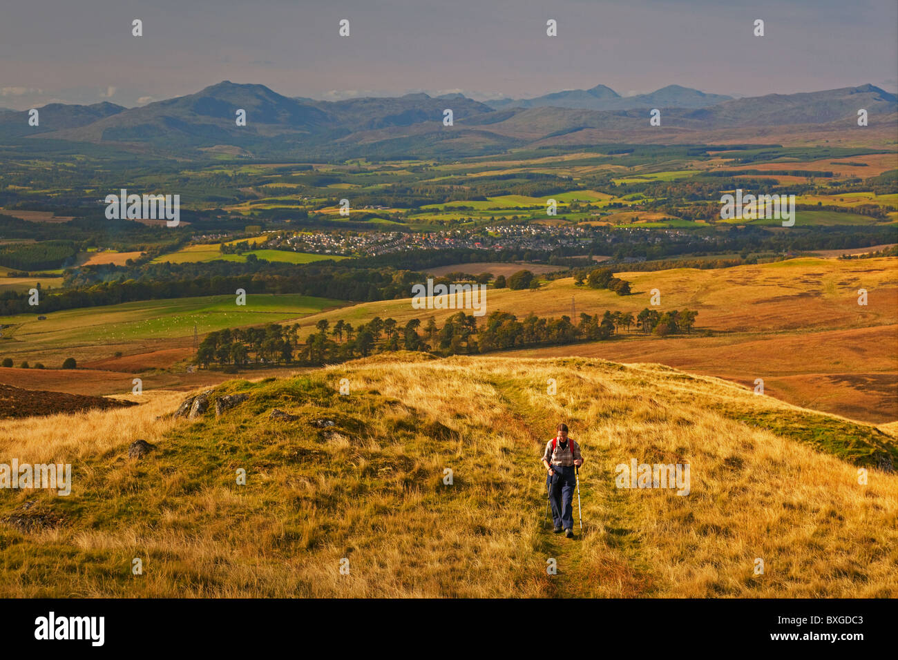 Approaching the summit of Dumyat in the Ochil Hills. Dunblane is in the background. Stock Photo