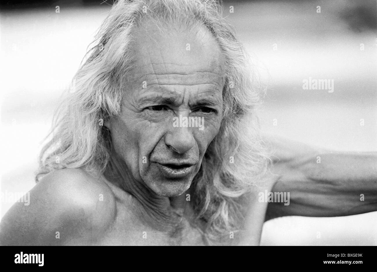 Portrait Of A Mature Man With Long Hair And An Anxious Expression