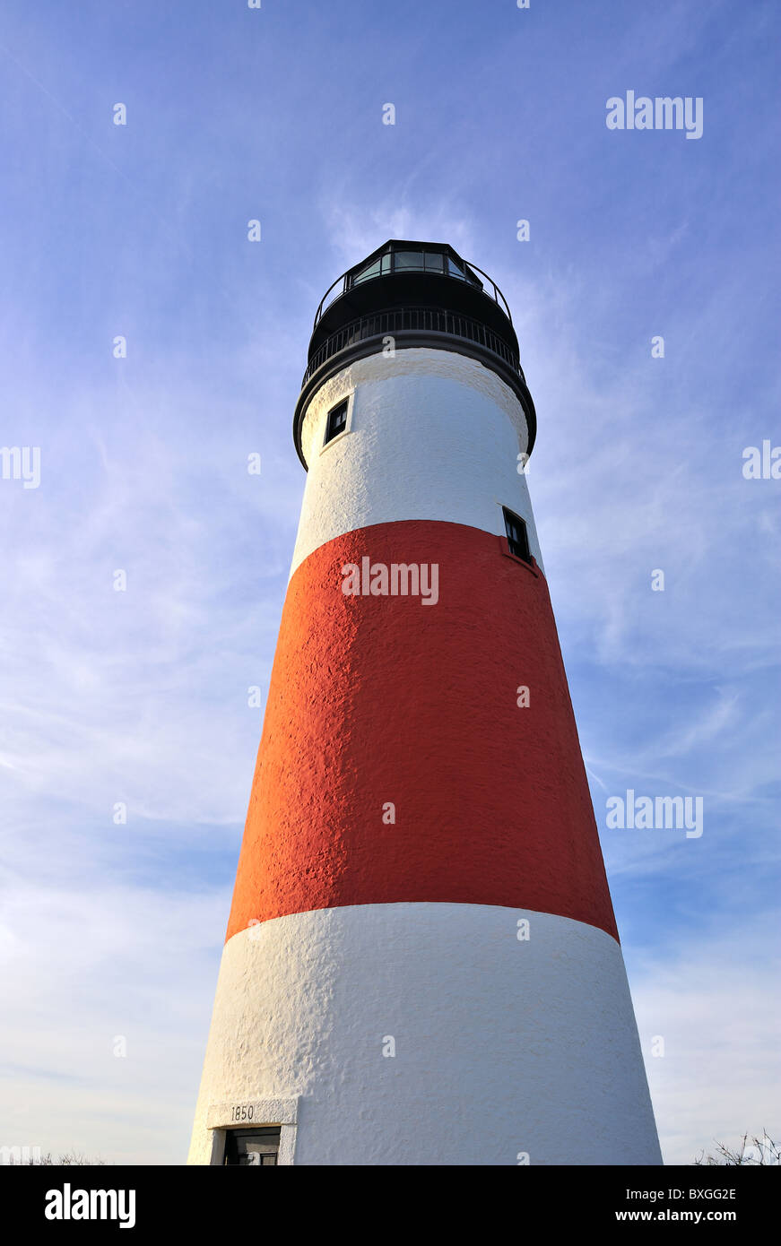 Dramatic wide-angle view looking up at Sankaty Head Light Lighthouse Nantucket, Massachusetts, USA Red and white stripe Stock Photo