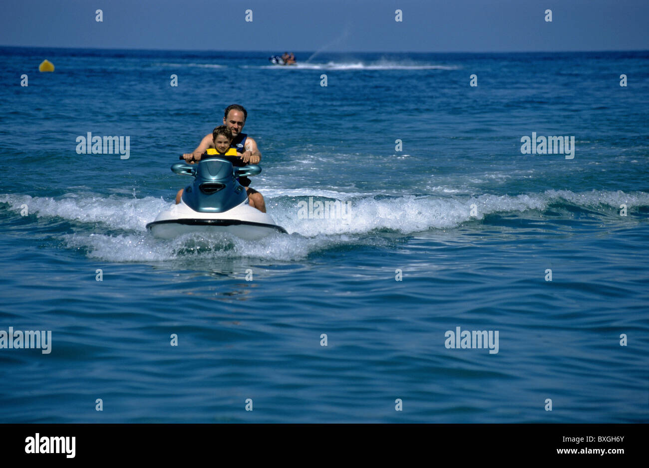 Father son riding jet ski hi-res stock photography and images - Alamy