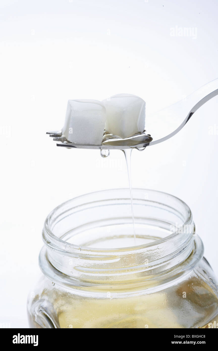syrup and white sugar cubes Stock Photo Alamy