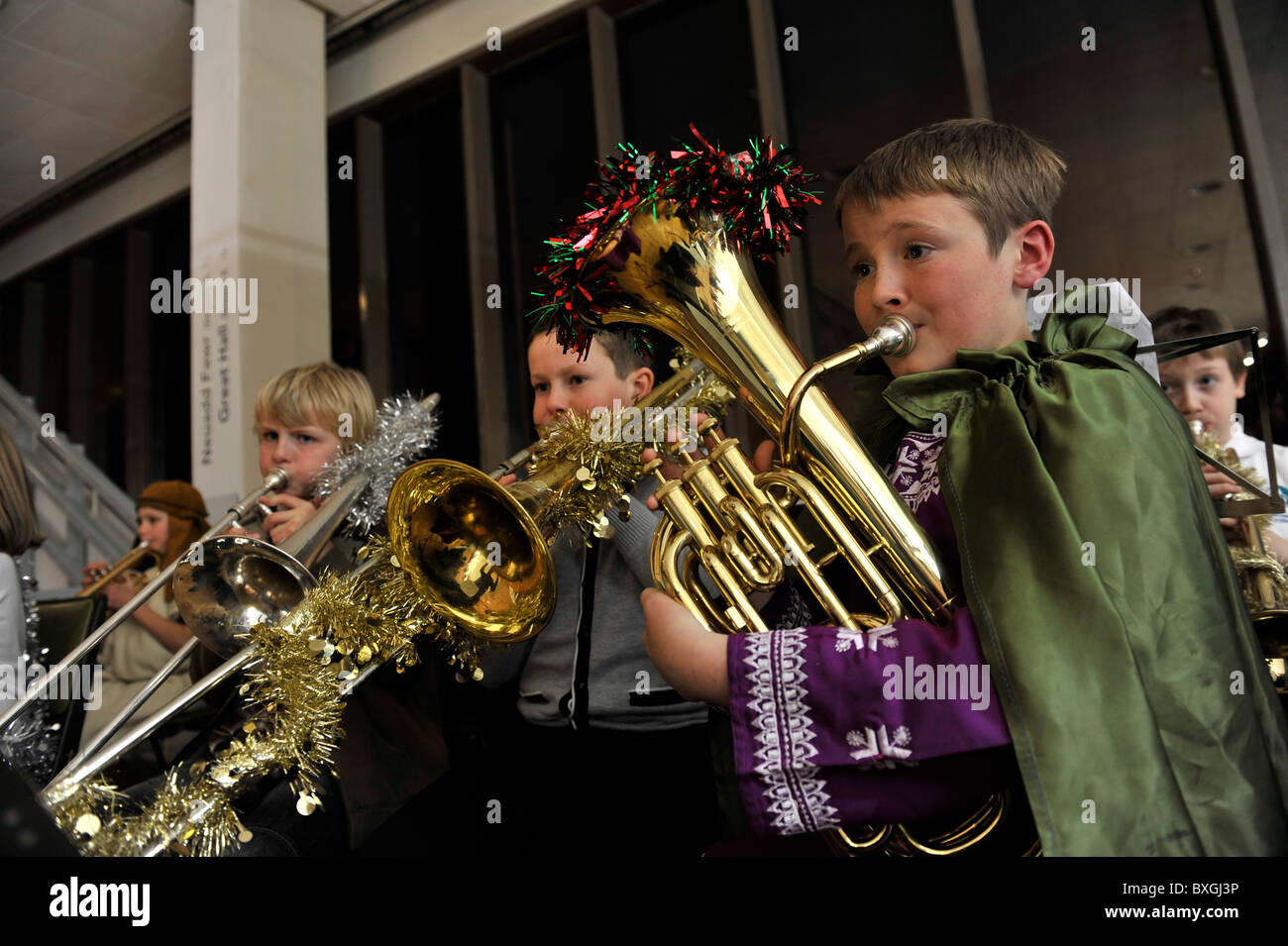 Children playing musical instruments in a primary school christmas