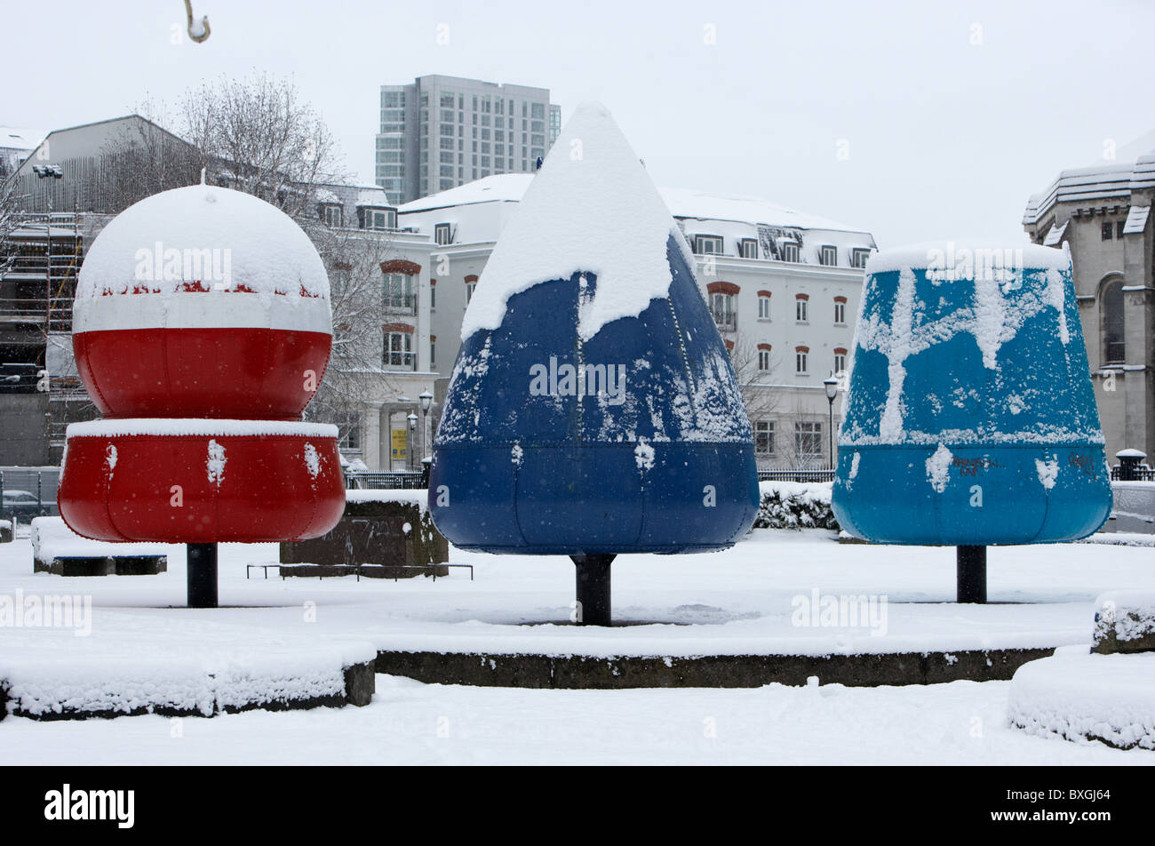 three bouys landmark covered in snow on a cold snowy winters day Belfast Northern Ireland Stock Photo