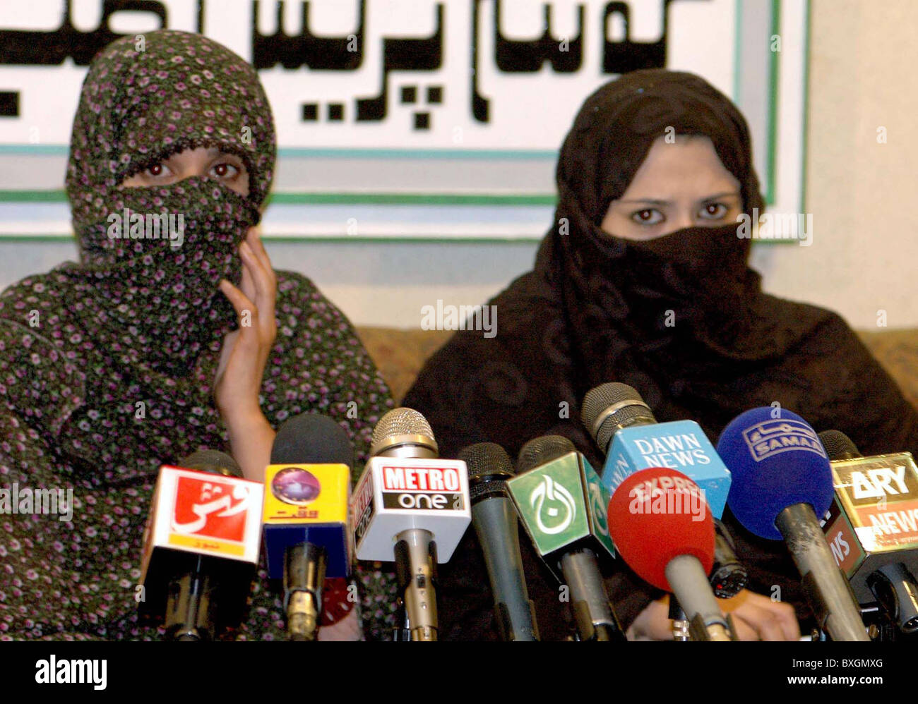 Veiled women relatives of Abdul Majeed Baloch addresses press conference about his missing at Quetta press club on Monday Stock Photo