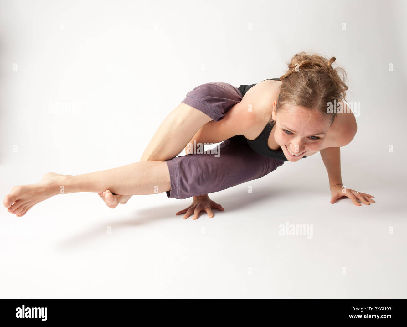 A young woman doing yoga Stock Photo - Alamy