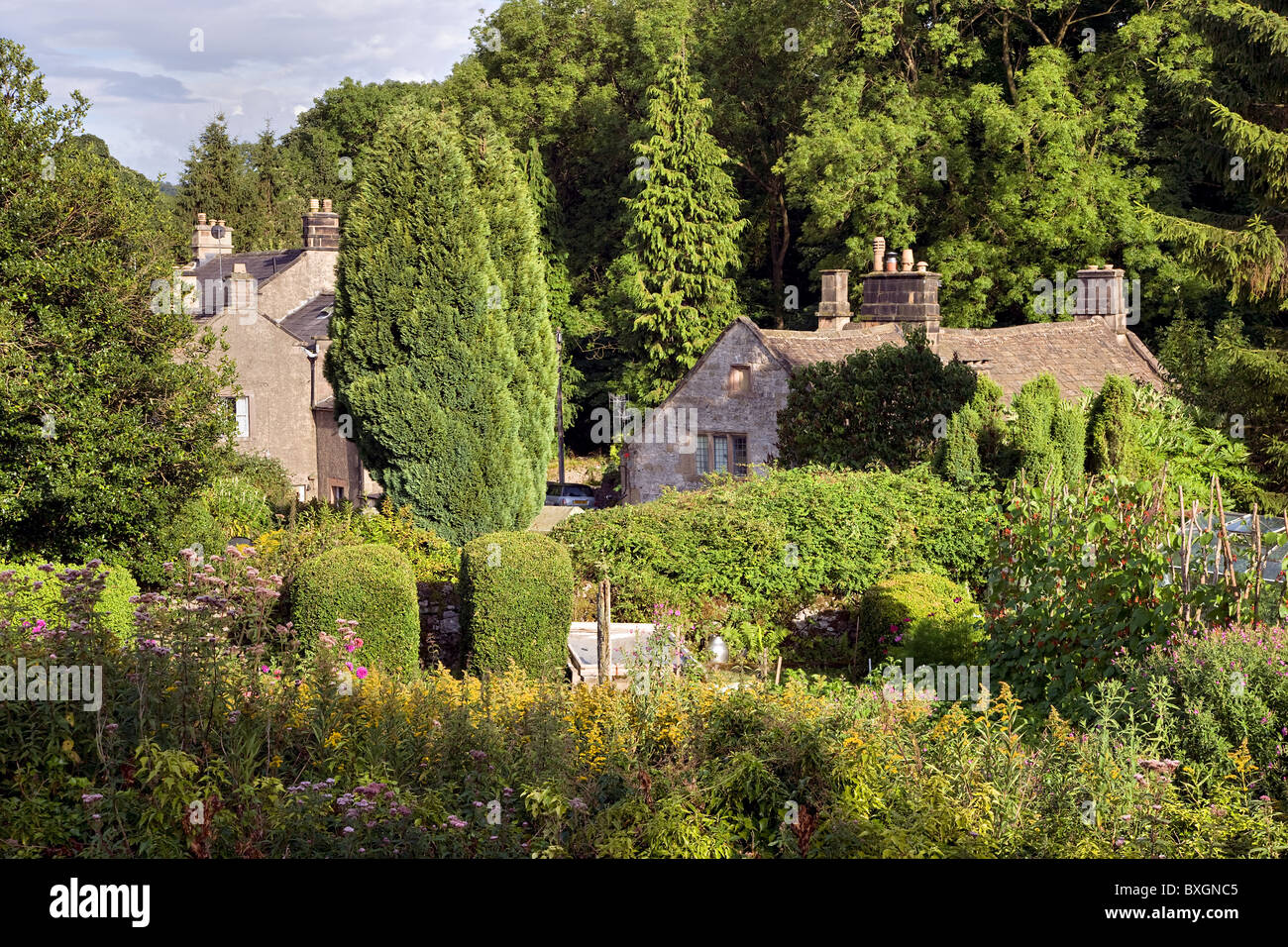 Riverside domestic gardens in the village of Alport in Derbyshire at