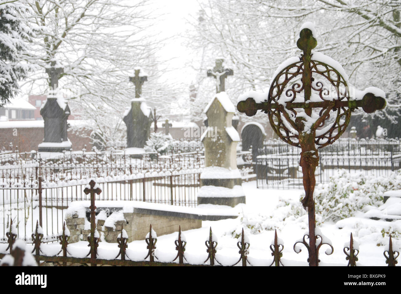 snow-covered tombstones at Het Oude Kerkhof in Roermond Netherlands Europe Stock Photo