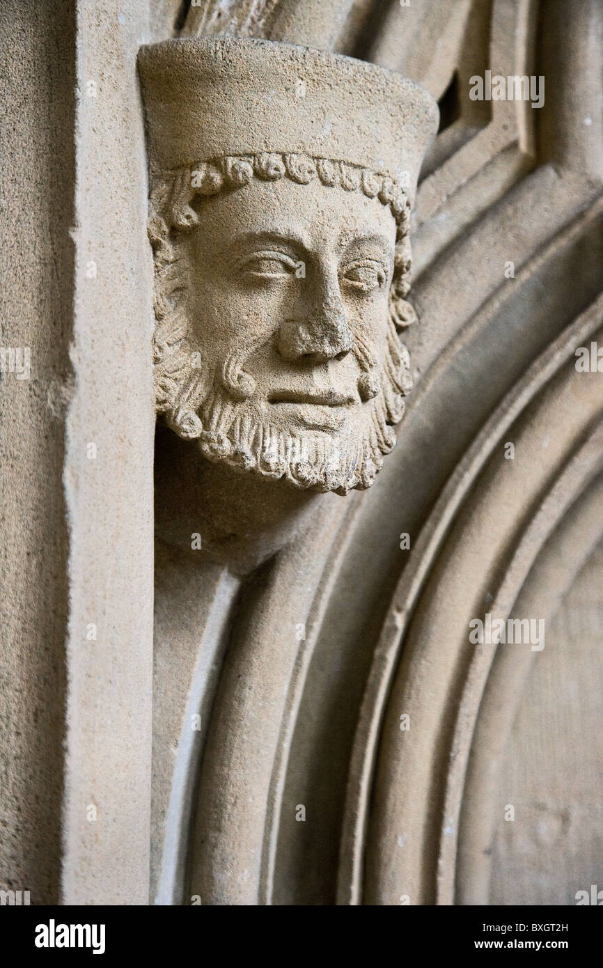 Stone sculpture said to represent the genial looking chief mason in the chapter house of Southwell Minster in Nottinghamshire Stock Photo