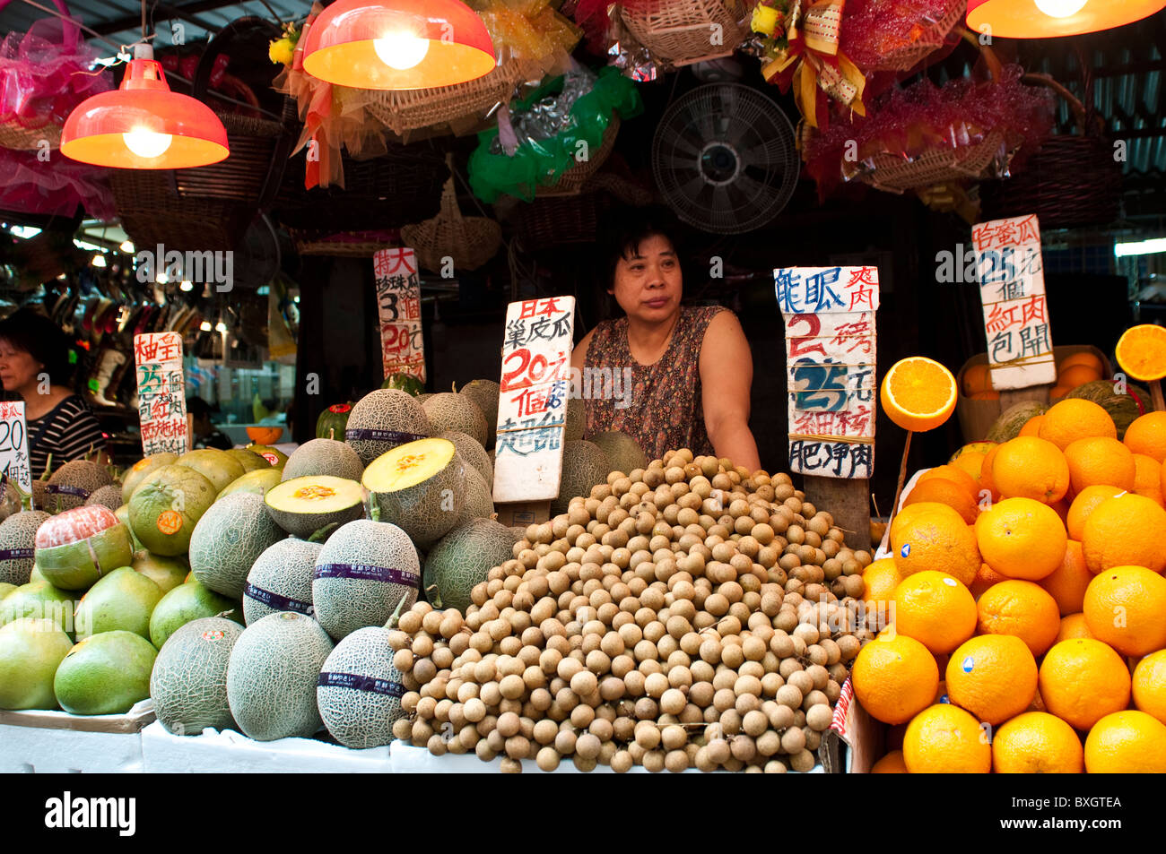 Seller at Fruit stall at the Ladies' Market, Mong Kok, Kowloon, Hong