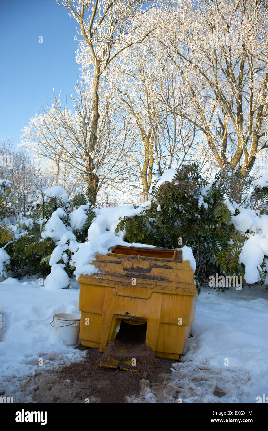 open local council grit and salt storage bunker on a cold snowy winters day Belfast Northern Ireland Stock Photo