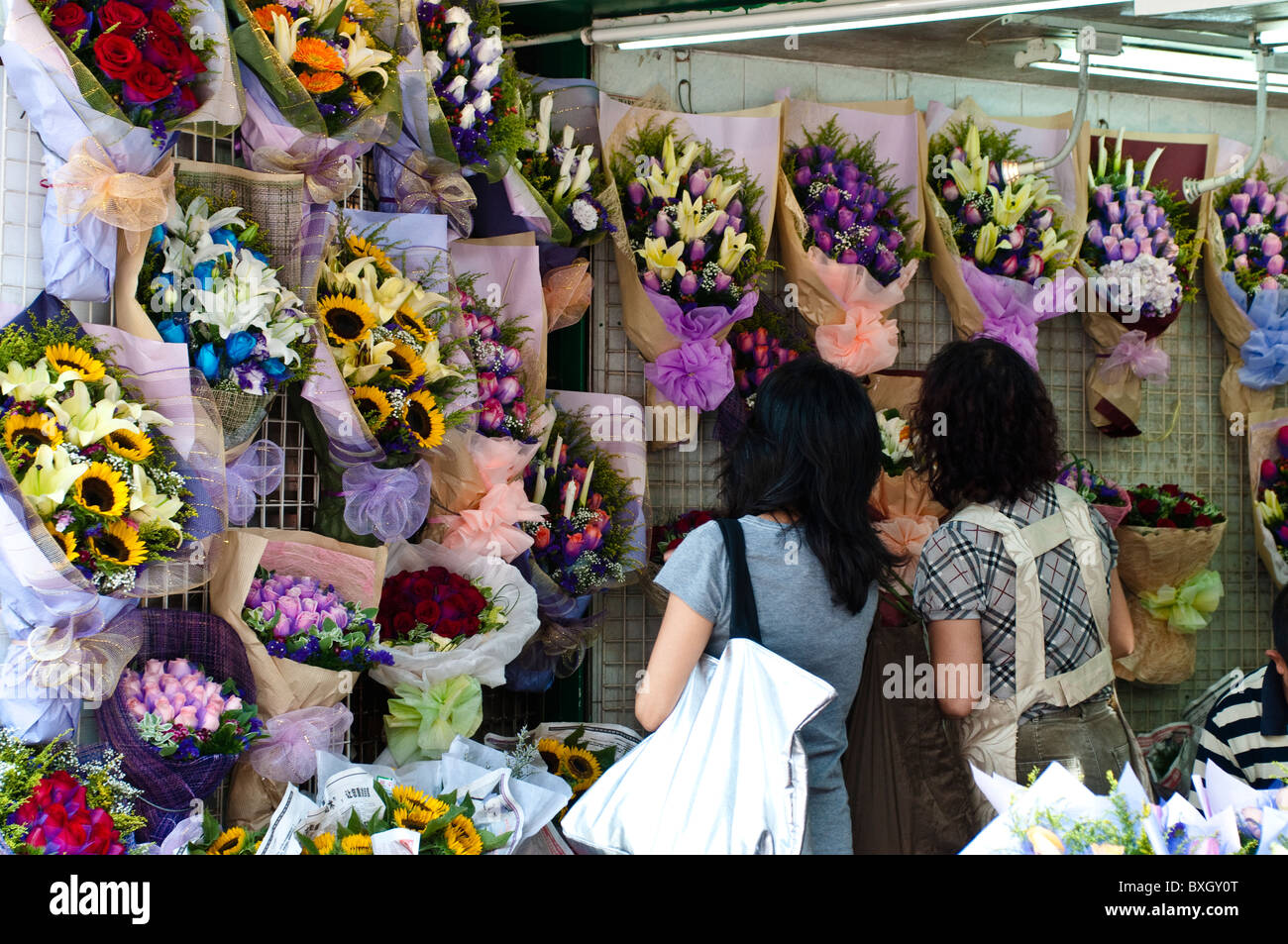 Shoppers at the Flower market, Mong Kok, Kowloon, Hong Kong, China