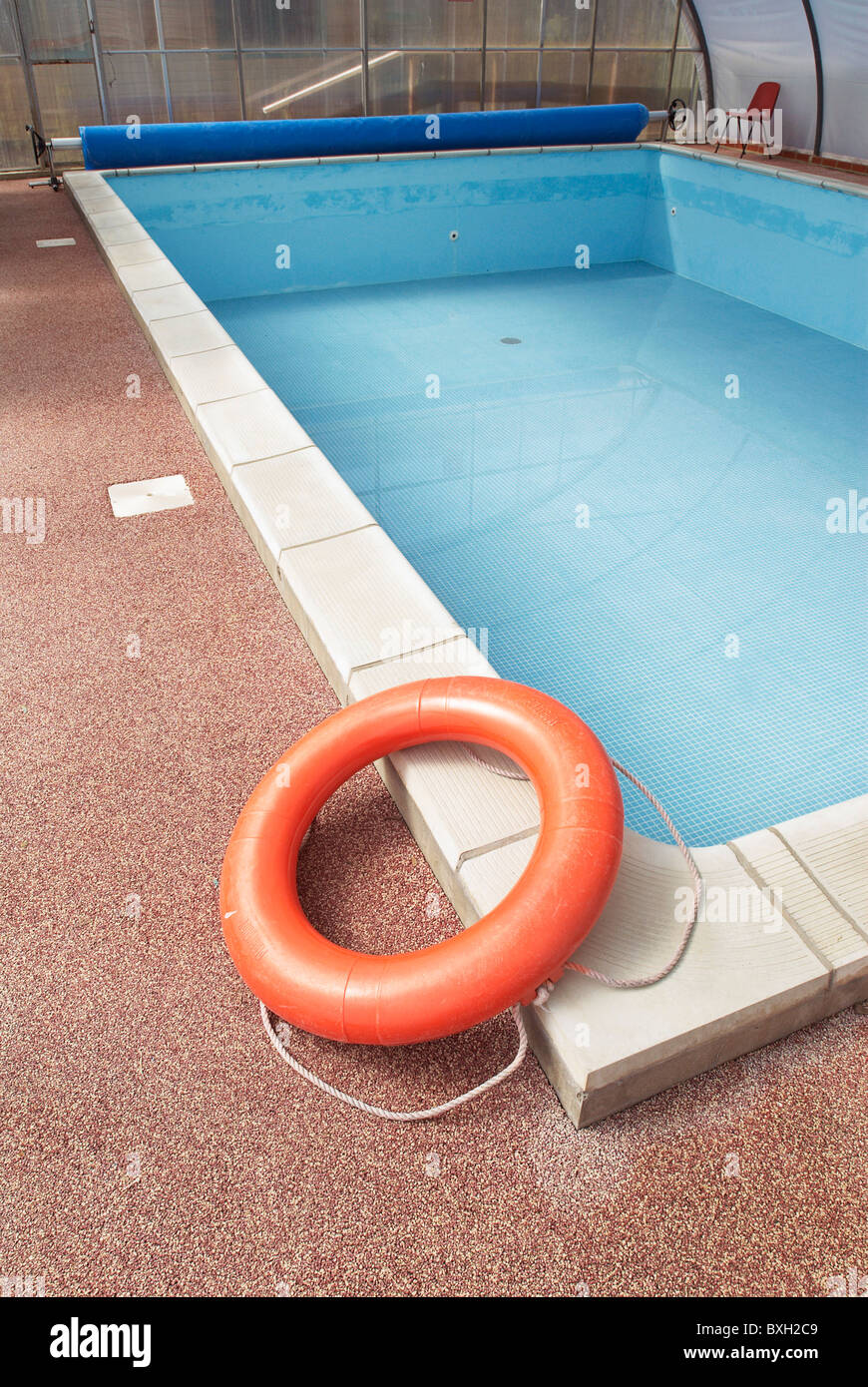 Empty swimming pool with polycarbonate roof Stock Photo - Alamy