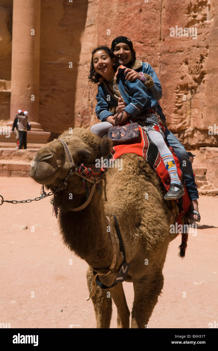 camel riding in Petra, the UNESCO World Heritage Site in Jordan Stock