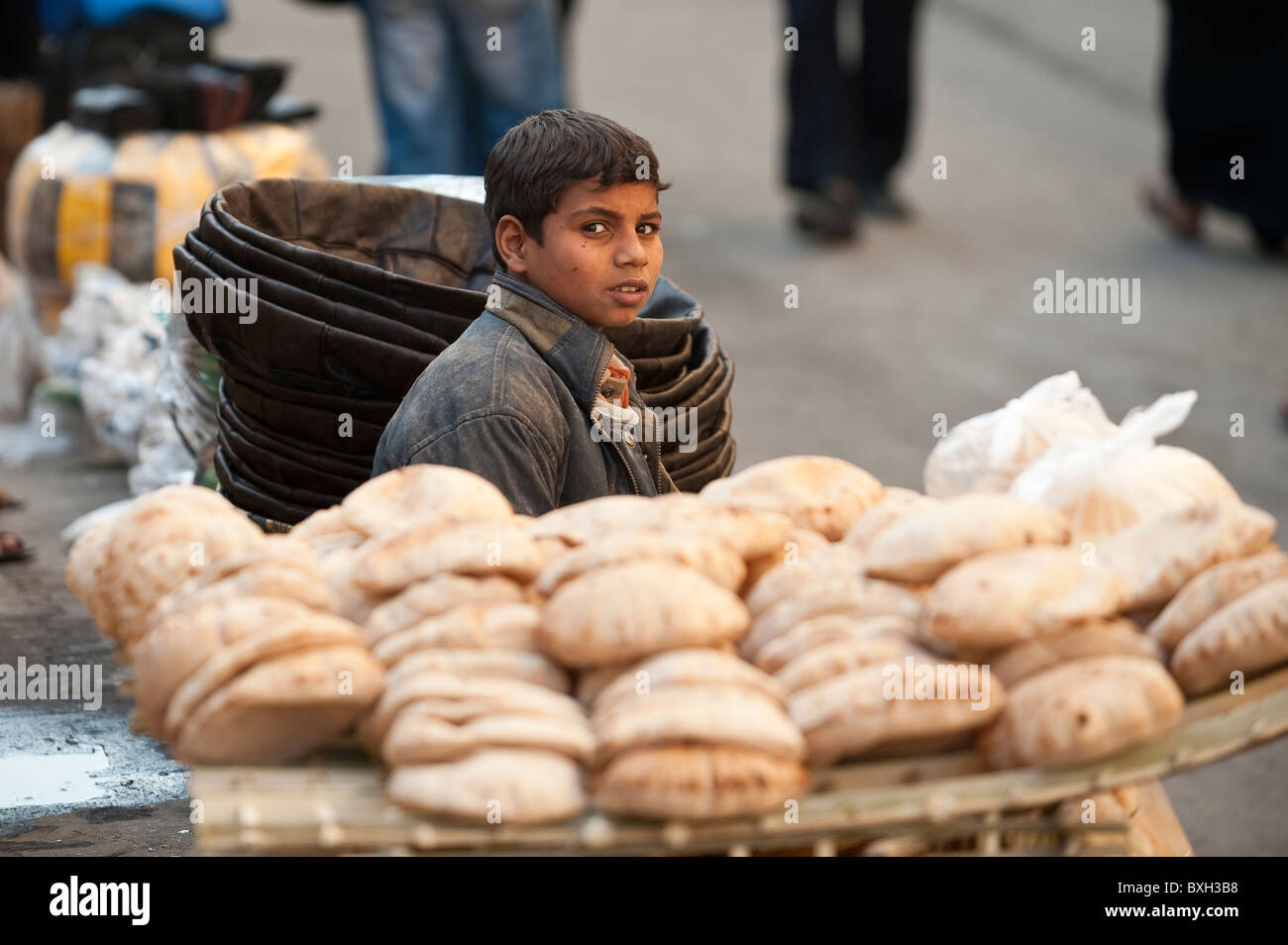 Egypt, Cairo. Bread vendor in the Khan el-khalili market Cairo. Stock Photo