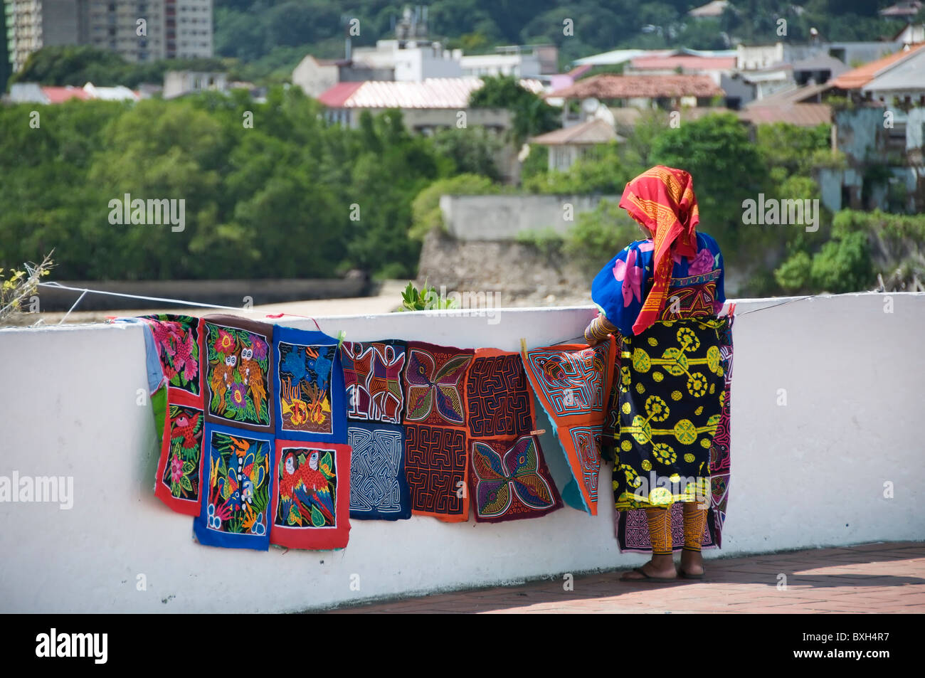 Back view of a Kuna woman displaying handicrafts for sale in Panama City, Panama. Stock Photo
