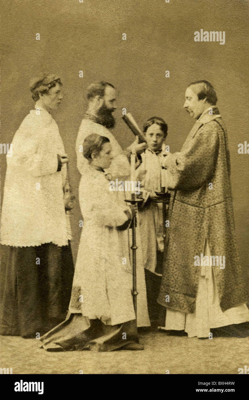 religion, Christianity, priest during church service, Brighton, Great Britain, circa 1873, 1870s, 19th century, historic, historical, Gospel, Gospel of Matthew, Gospel of Mark, Gospel of Luke, Gospel of John, Bible, the teachings of the Bible, acolyte, acolytes, chasuble, Anglican, ceremonial, photograph by W & A. H. Fry, Art Photographers and Miniature Painters, 68, East Street, Brighton, ceremony, Christians, people, Additional-Rights-Clearences-Not Available Stock Photo